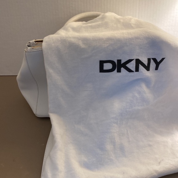 DKNY white handbag. Gold hardware. Strap and storage bag included. - Picture 8 of 8